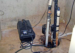 Pedestal sump pump system installed in a home in Methuen